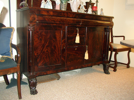 The finish on this Empire sideboard is almost the same age as that on the Federal drawer and is original but it has been 'polished.' Is it more attractive than the drawer?